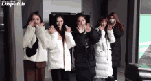 a group of girls are posing for a picture with dispatch in the corner