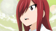 a close up of a girl with red hair making a surprised face