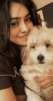 a woman is holding a small white dog with the words " i love you " written on the bottom