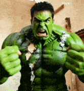 a man dressed as the hulk with a fist in his hand