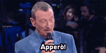 a man in a suit is holding a microphone and says apperd