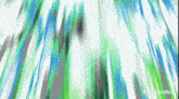 a blurry picture of a green and blue background with a few lines coming out of it .