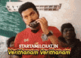 a man in a red shirt is talking on a cell phone with the words starttamilchat in verithanam verithanam