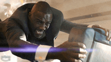 a man in a suit is flying through the air with the word prime visible