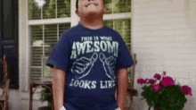 a boy wearing an awesome looks like shirt