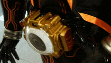 a close up of a person 's waist with a belt that has a clock on it