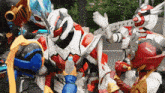 a group of robots are fighting each other on a street .
