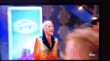 a blurred image of a woman on a tv show with abc written on the bottom