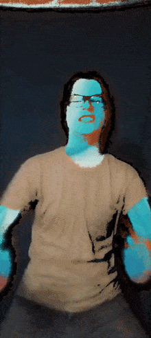 a man wearing glasses and a tan shirt has a blue and white face