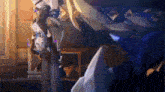a cartoon character is hanging upside down from a pillar in a room .