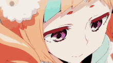 a close up of a girl 's face with purple eyes .