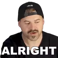 a man with a beard wearing a black hat and a black shirt says " alright "