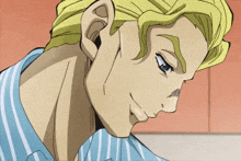 a close up of a man 's face with a blue shirt on