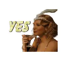 a woman holding a glass of wine with the word yes written in gold