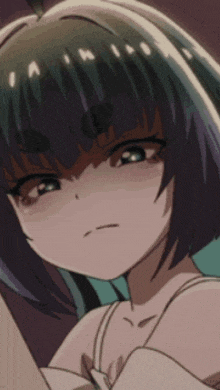 a close up of a girl 's face with the letters a and m on her head