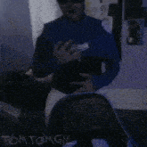 a blurry picture of a person with the name tomtomgil written on the bottom