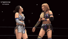 two female wrestlers in a ring with the word stardom on the bottom