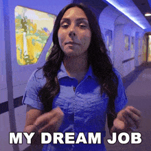 a woman says " my dream job " in a hallway