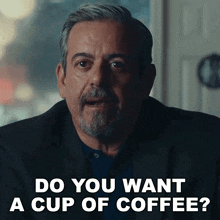 a man with a beard is asking if he wants a cup of coffee