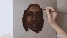 a painting of a woman 's face is being made in animotica