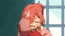 a girl with red hair and a pink sweater is crying