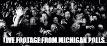 a black and white photo of a crowd of people with the words live footage from michigan polls
