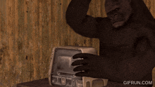 a gif from gifrun.com features a gorilla