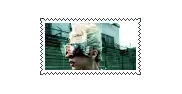 a postage stamp with a picture of a woman wearing sunglasses .