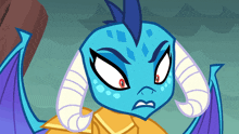 a blue cartoon character with horns and a mohawk