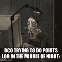a cartoon character is sitting in front of a computer with a lamp .