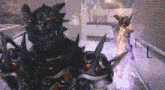 a group of monsters are standing next to each other in a room .