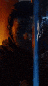 a blurred image of a man talking on a cell phone with the number 13 visible