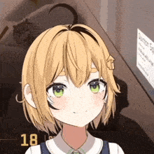 a girl with short blonde hair and green eyes is smiling in front of a sign that says quantum sq