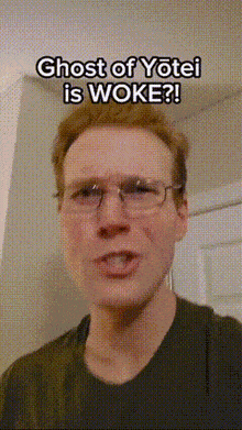 a man wearing glasses and a black shirt says ghost of yotei is woke