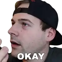 a man wearing a black hat with the word okay on his face