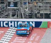 a race car that has the word halmar on the back of it