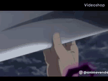 a person is holding a piece of paper in their hand in a cartoon .