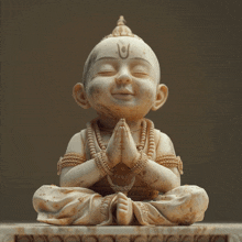 a statue of a child with a symbol on his forehead