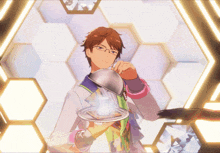 a man with glasses is holding a tray in front of a honeycomb background