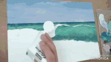 a person is painting a beach scene with a tube of crayola