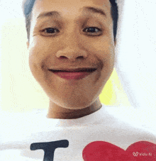 a man wearing a t-shirt that says i love on it