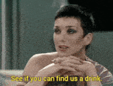 a woman says " see if you can find us a drink " in yellow letters