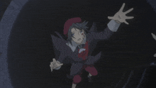 a person 's hand is reaching out towards a circle in the dark