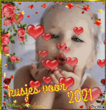 a picture of a little girl blowing kisses with hearts around her face