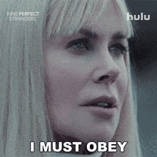 a close up of a woman 's face with the words " i must obey " above her