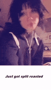 a girl with short hair is smoking a cigarette and the words `` just got split roasted '' are below her .