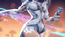 a woman in a white suit is holding a glass of water