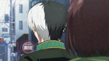 a man with half black and half white hair is looking at another person