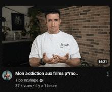 a man wearing a white shirt that says " mon addiction aux films porno "