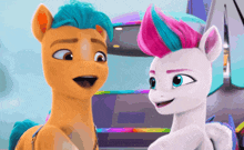 a couple of ponies are standing next to each other